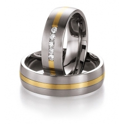 Pár snubních prstenů v kombinaci titan se zlatem